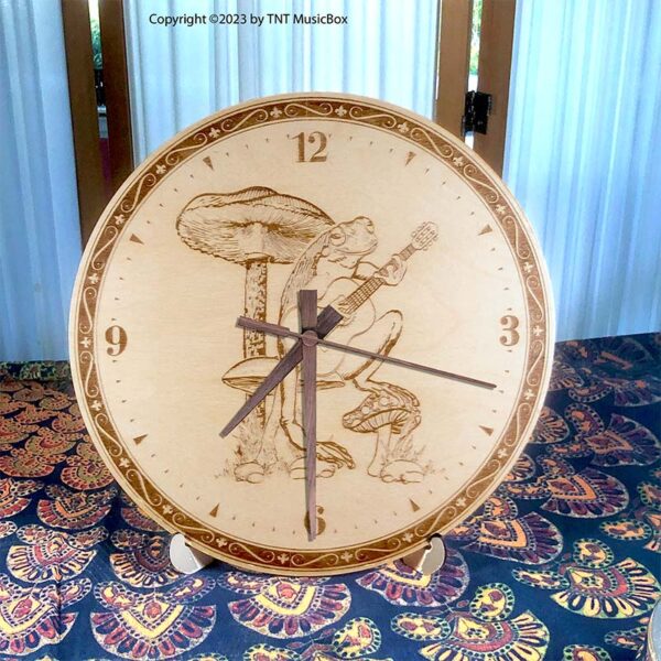 Frog Playing Guitar Wall Clock. Laser engraved, 11.25" in diameter. 6mm Baltic Birch.